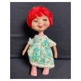 Two Vintage Vinyl Dolls - Red-Haired Floral Dress Doll & Orange-Haired Yellow Romper Doll