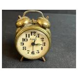 Collection of Vintage Table Clocks, Open Pan Oil Lamps, Glass Mixer, and Carved Wooden Stand