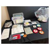 Collection of Handmade Cross-Stitch Ornaments and Craft Supplies