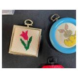 Collection of Handmade Cross-Stitch Ornaments and Craft Supplies