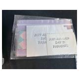 Collection of Handmade Cross-Stitch Ornaments and Craft Supplies