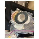 Collection of Handmade Cross-Stitch Ornaments and Craft Supplies