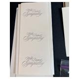 Collection of Handmade Cross-Stitch Ornaments and Craft Supplies