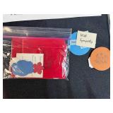 Collection of Handmade Cross-Stitch Ornaments and Craft Supplies