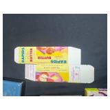 Vintage Kitchenware Collection with Cookie Cutters, Butter Boxes, Glass Dishes, and Decorative Tin