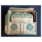 Vintage Kitchenware Collection with Cookie Cutters, Butter Boxes, Glass Dishes, and Decorative Tin