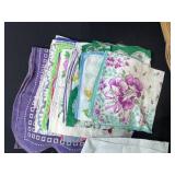 Vintage Handkerchief and Linen Collection with Basket, Flour Sack Apron, and Wooden Wine Holder