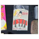 Vintage Hair Styling Accessory Collection with Curlers, Nets, Bobby Pins, and Trophy