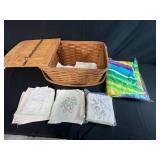Vintage Woven Picnic Basket with Embroidered Tea Towels and Linens