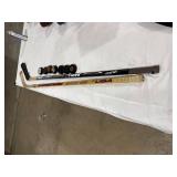 Hockey Sticks and Pucks Lot