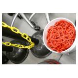 2 Chain stancions and a bucket of plastic chain