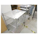 TWO small metro shelves on wheels