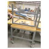 Two tables one with wheels