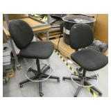 2 black office chairs