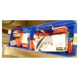 Office supplies, probably 25 tape dispensers, new boxes of tape, paper clips and a bunch of note pads