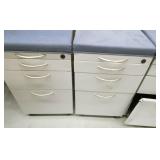 Four padded seat file cabinets