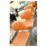 12 orange plastic seat tall chairs