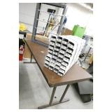 Folding table with custom 32 slot organizer and a paper roll dispenser