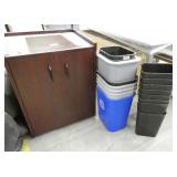 Cabinet and a group of waste baskets