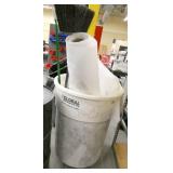 garbage barrel with roll of poly and broom
