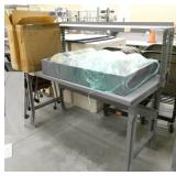 Metal workbench with riser shelf and contents