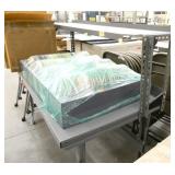 Metal workbench with riser shelf and contents