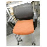 Set of 4 Orange cushion stacking chairs with wheels