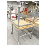 Two rolling worktables 31x34