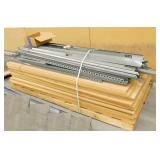 6 pallets full of (green) steel garage shelving with wood shelving