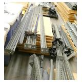 6 pallets full of (green) steel garage shelving with wood shelving