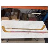 Two Ice Hockey Sticks