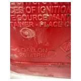 Three Red Plastic Gas Cans