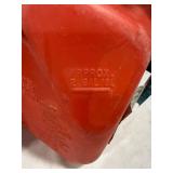 Three Red Plastic Gas Cans