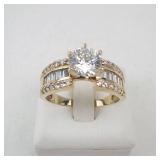 Lady’s 14K Yellow Gold Cubic Zirconia Ring with Baguette & Round Accents. Ring Size 10.