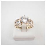 Lady’s 14K Yellow Gold Cubic Zirconia Ring with Baguette & Round Accents. Ring Size 10.