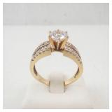 Lady’s 14K Yellow Gold Cubic Zirconia Ring with Baguette & Round Accents. Ring Size 10.