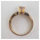 Lady’s 14K Yellow Gold Cubic Zirconia Ring with Baguette & Round Accents. Ring Size 10.