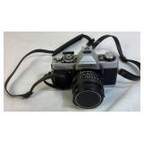 Minolta XG7 Single Lens Reflex 35mm Camera Serial #1275017 with 55mm Hoya Skylight Lens and Tripod