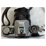 Minolta XG7 Single Lens Reflex 35mm Camera Serial #1275017 with 55mm Hoya Skylight Lens and Tripod