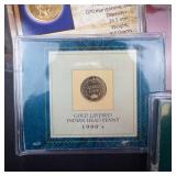 an assortment of 6 various gold plated coins: 3 IHP