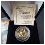 an assortment of 6 various gold plated coins: 3 IHP