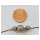 Elegant Silver Anklet with Textured Beads