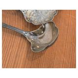 Lot of (7) 282-grams (total) Silverplated Flatware - 1847 Rogers Bros Gravy Ladle, Gorham Gravy Ladle, W.M. Rogers Camelot-Melody Fruit Spoons (x2), Sugar Sifter, Decorative Wide Spoon, Decorative Tea