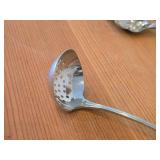 Lot of (7) 282-grams (total) Silverplated Flatware - 1847 Rogers Bros Gravy Ladle, Gorham Gravy Ladle, W.M. Rogers Camelot-Melody Fruit Spoons (x2), Sugar Sifter, Decorative Wide Spoon, Decorative Tea