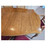 Elegant French Provincial Dining Table with Cane-Back Chairs