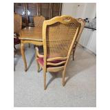 Elegant French Provincial Dining Table with Cane-Back Chairs