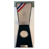 1991 Korean War Proof Memorial Dollar Coin - original package with COA, slight fire damage is evident