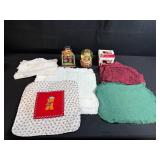 Holiday Decor and Linens Lot with Snowman Block Calendar, Santa Snow Globe, Tree Topper, and Doilies