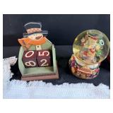 Holiday Decor and Linens Lot with Snowman Block Calendar, Santa Snow Globe, Tree Topper, and Doilies