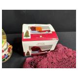 Holiday Decor and Linens Lot with Snowman Block Calendar, Santa Snow Globe, Tree Topper, and Doilies